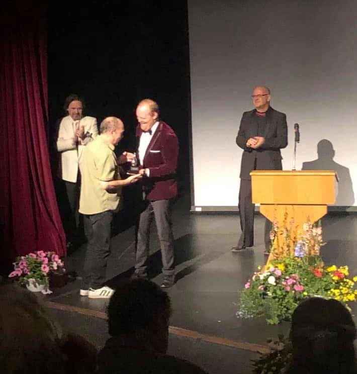 Jim receiving Buddy Award